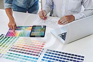 Two interior design or graphic designer at work on project of ar