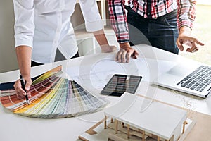 Two interior design or graphic designer at work on project of ar