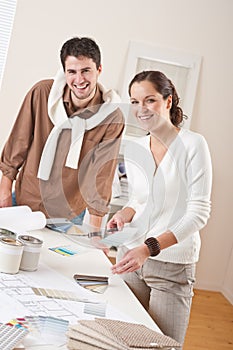 Two interior designer working with color swatch