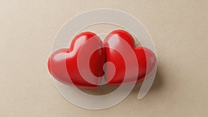 Two interlocking red hearts