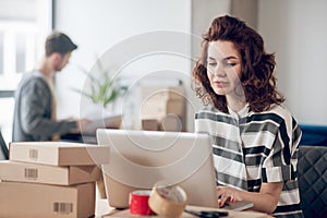 Two Internet shop workers working in the office