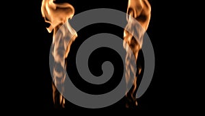 Two isolated fire flames, slow motion gas ignition from bottom to top, high speed flamethrower on black background. The