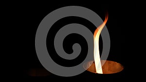 Two isolated fire flames, slow motion gas ignition from bottom to top, high speed flamethrower on black background. The