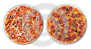 Two italian pizzas isolated top view