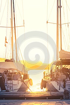 Two jachts in marina, on a summer sunset; summertime background with copy space