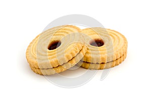 Two jam filled biscuits over white