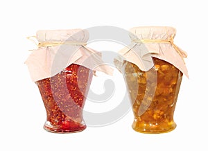 Two jars of fruit jam on white background