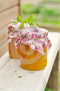 Two Jars of Pumpkin Jam on a Bench, copy space for your text