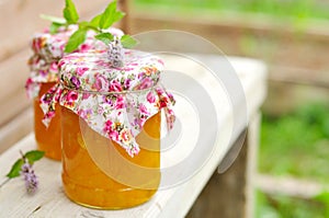 Two Jars of Pumpkin Jam on a Bench, copy space for your text