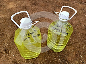 Two jars of Sodium Hypo Chlorite chemical, a type of disinfectant. It is used a sanitizer.