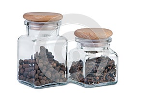 Two Jars of Spices on White