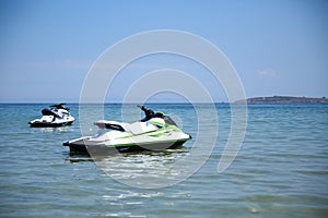 Two jet skis in the open ocean. photo