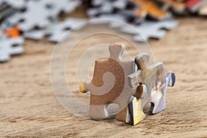 Two Jigsaw Puzzle Pieces on Table