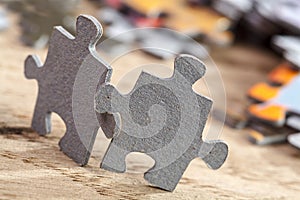 Two jigsaw puzzle pieces on table