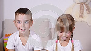 Two joyful kids showing their blotted palms