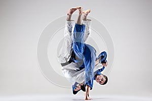 The two judokas fighters fighting men