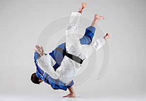 The two judokas fighters fighting men