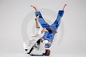 The two judokas fighters fighting men