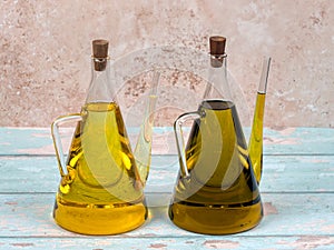 Two jugs of sunflower and olive oil