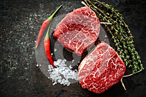 Two juicy filet Mignon beef steaks prepared for grilling