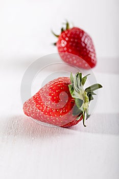 Two juicy strawberry on the table