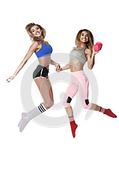 Two fitness girl on white baground