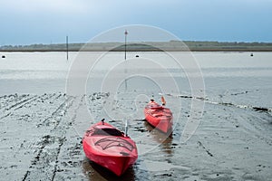 Two kajak in Essex, England\'s mudflats.