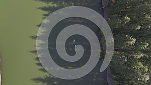 Two Kayak Boats Swimming along the River a Top Aerial Shot Looking Down