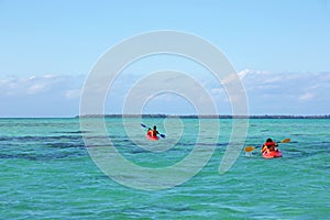 Two kayakers in the huge lagoon of Tahaa