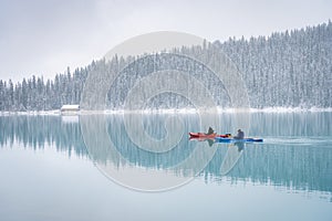 Two kayaks on azure alpine lake during early winter, Banff N. Park, Canada