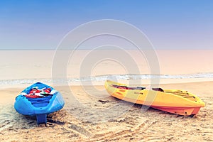 Two kayaks on the beach early in the morning.