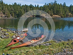 Two kayaks on rocky shore