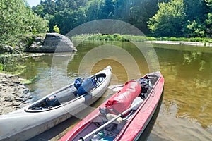 Two kayaks standing in water