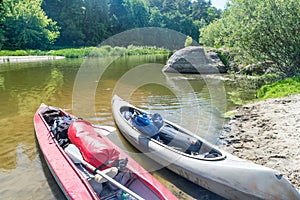 Two kayaks standing in water