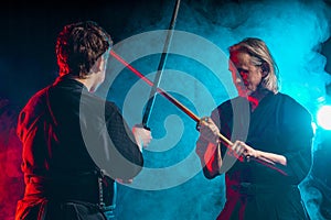 Two kendo fighters practicing kenjutsu, Japanese martial art using swords