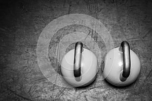 Two Kettle bells on the floor.