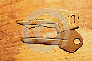 Two keys isolated on a wooden background. safety and security concept