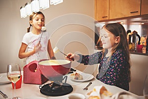 Kids eating fondue photo