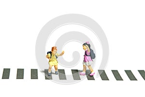 Two kid kindergarten student walking above zebra crossing road