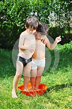 Two kids in basin