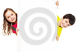 Two kids with blank ad board