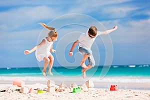 Two kids crushing sandcastle