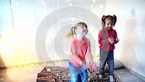 Two kids dancing at home christmas party