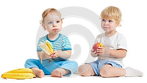Two kids eating healthy food