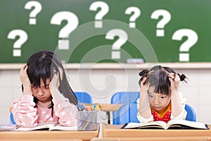 Two kids is full of questions in class