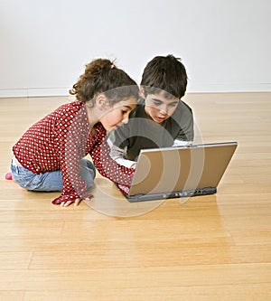 Two kids with laptop computer