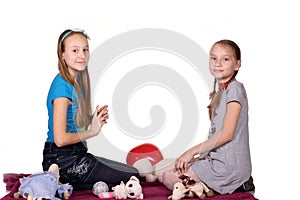 Two kids play together, isolated on white background