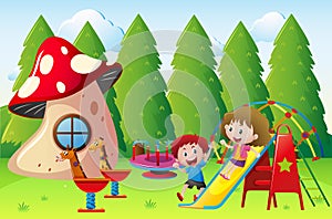 Two kids playing slide in the park