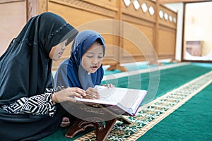 Two kids read holy quran