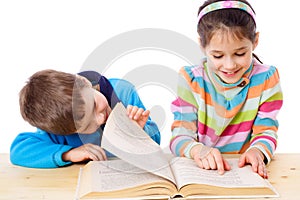 Two kids reading the book